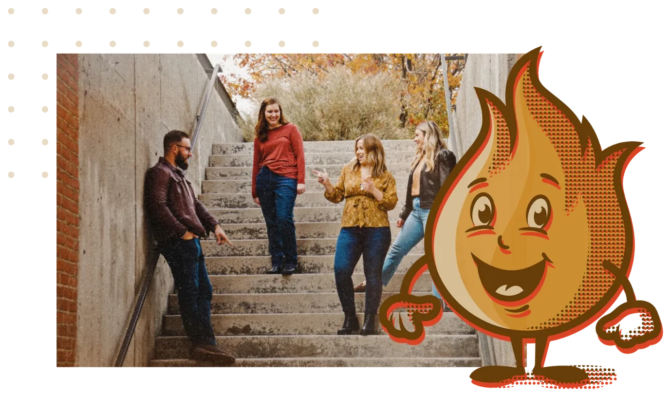 The Forge team on a set of concrete stairs, with Spark beside them